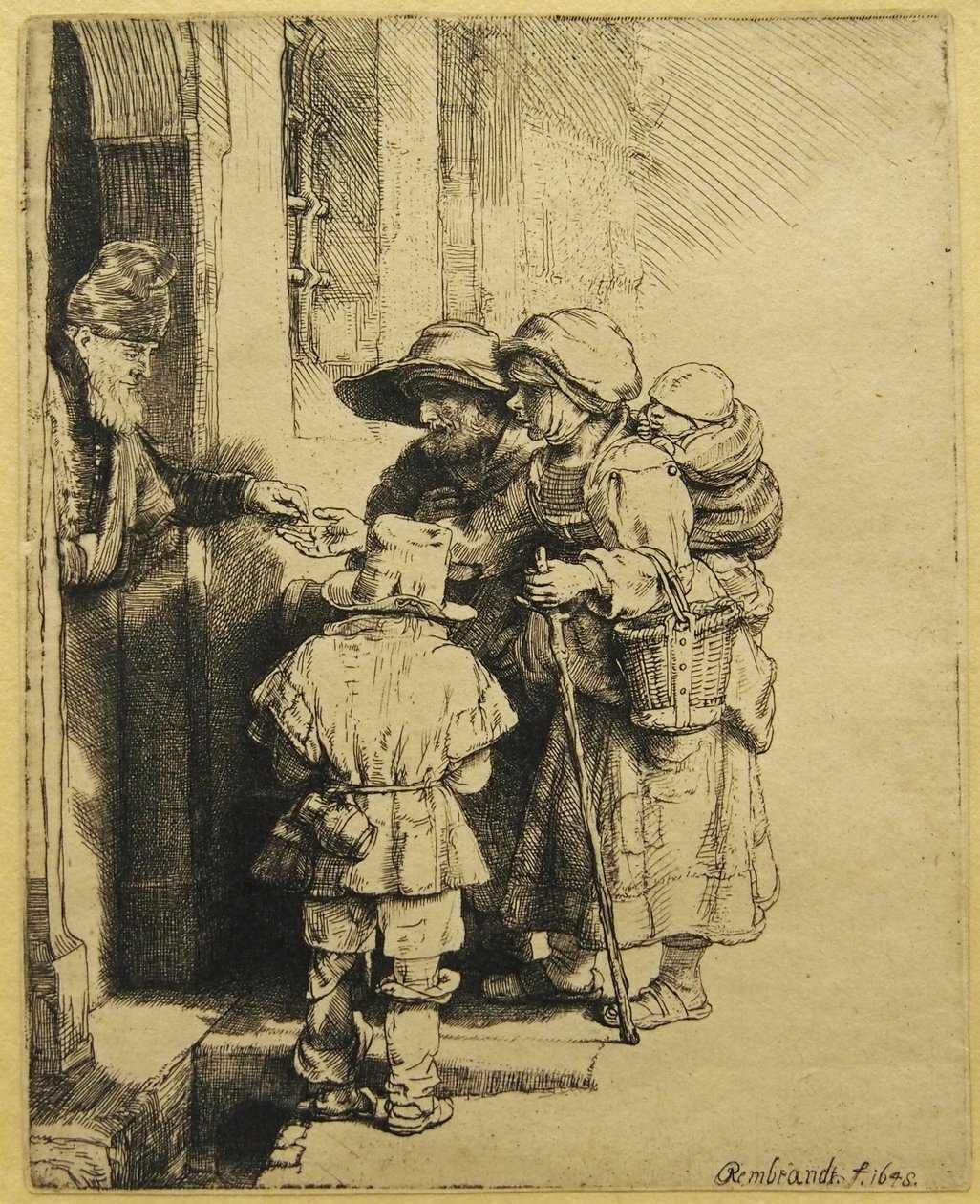 Un Jugador de Zanfona Ciego y Familia Recibiendo Limosna de Rembrandt van Rijn