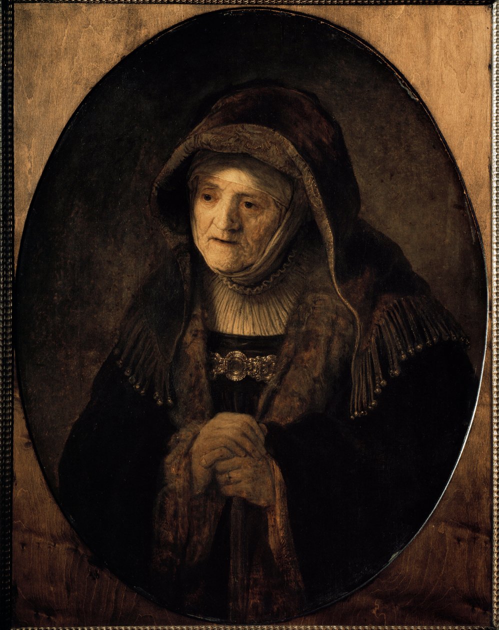 Retrato de la madre del artista apoyada en su bastón de Rembrandt van Rijn