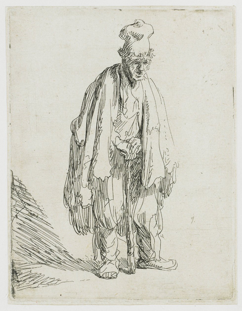 Mendigo con una gorra de visera ancha, de pie y apoyado en un bastón de Rembrandt van Rijn