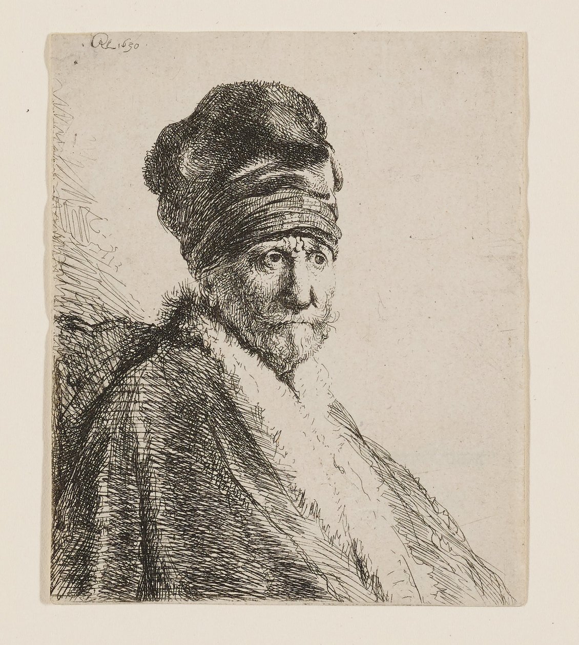 Busto de un hombre con una gorra de visera alta de Rembrandt van Rijn