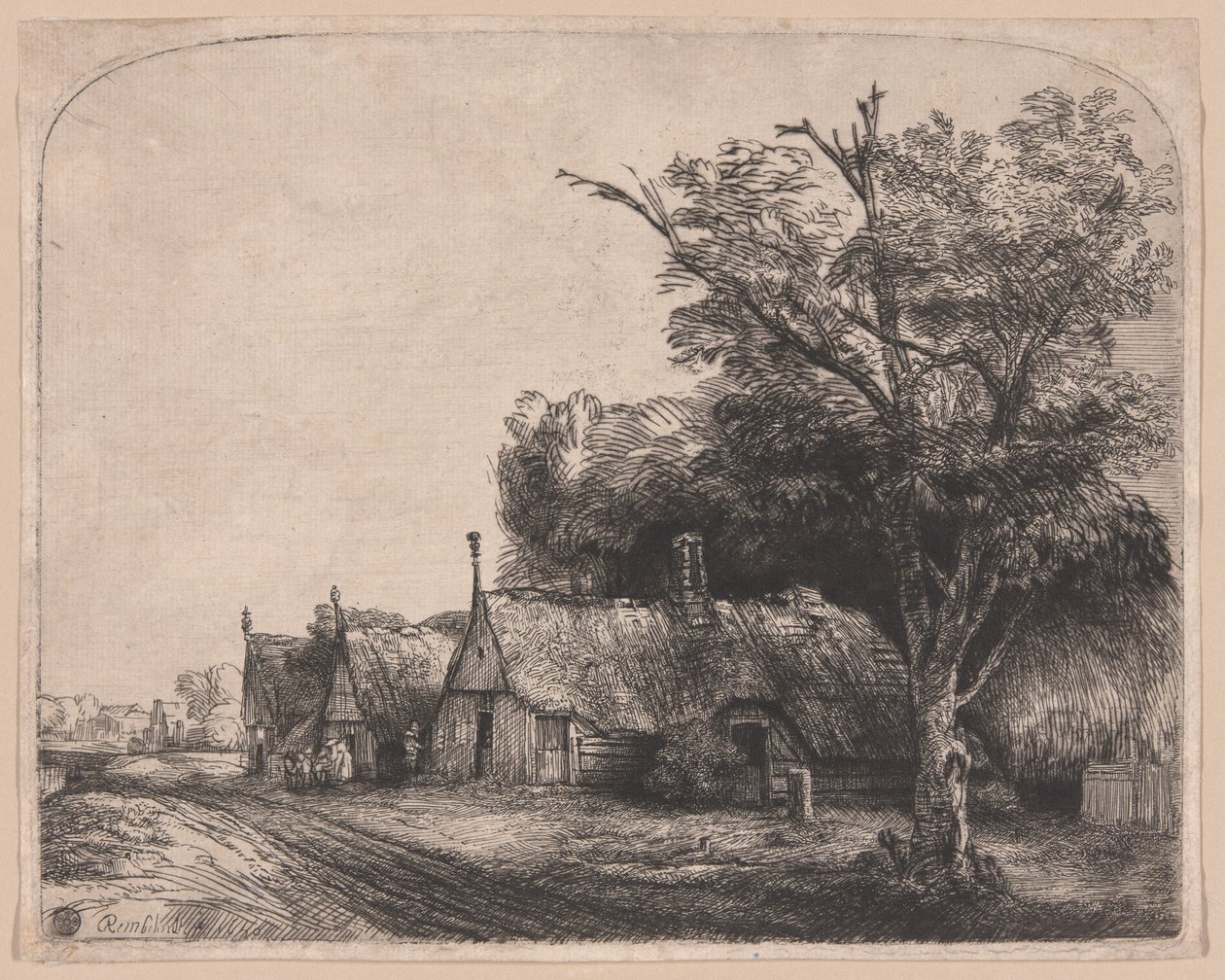 Paisaje con tres cabañas de tejado a dos aguas junto a un camino de Rembrandt van Rijn