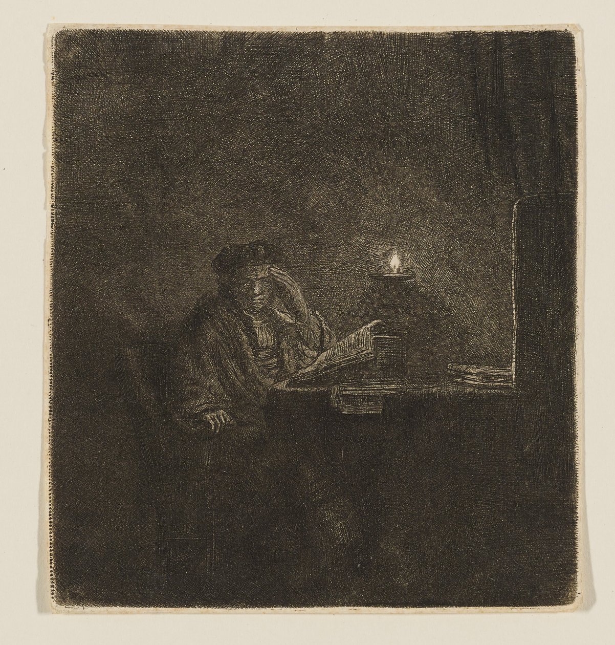 Un estudiante sentado a la luz de una vela de Rembrandt van Rijn