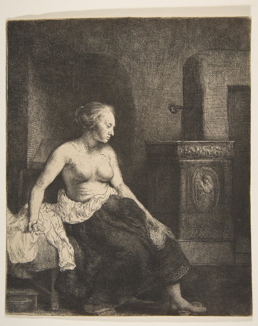 Mujer sentada medio vestida junto a una estufa, 1658 de Rembrandt van Rijn