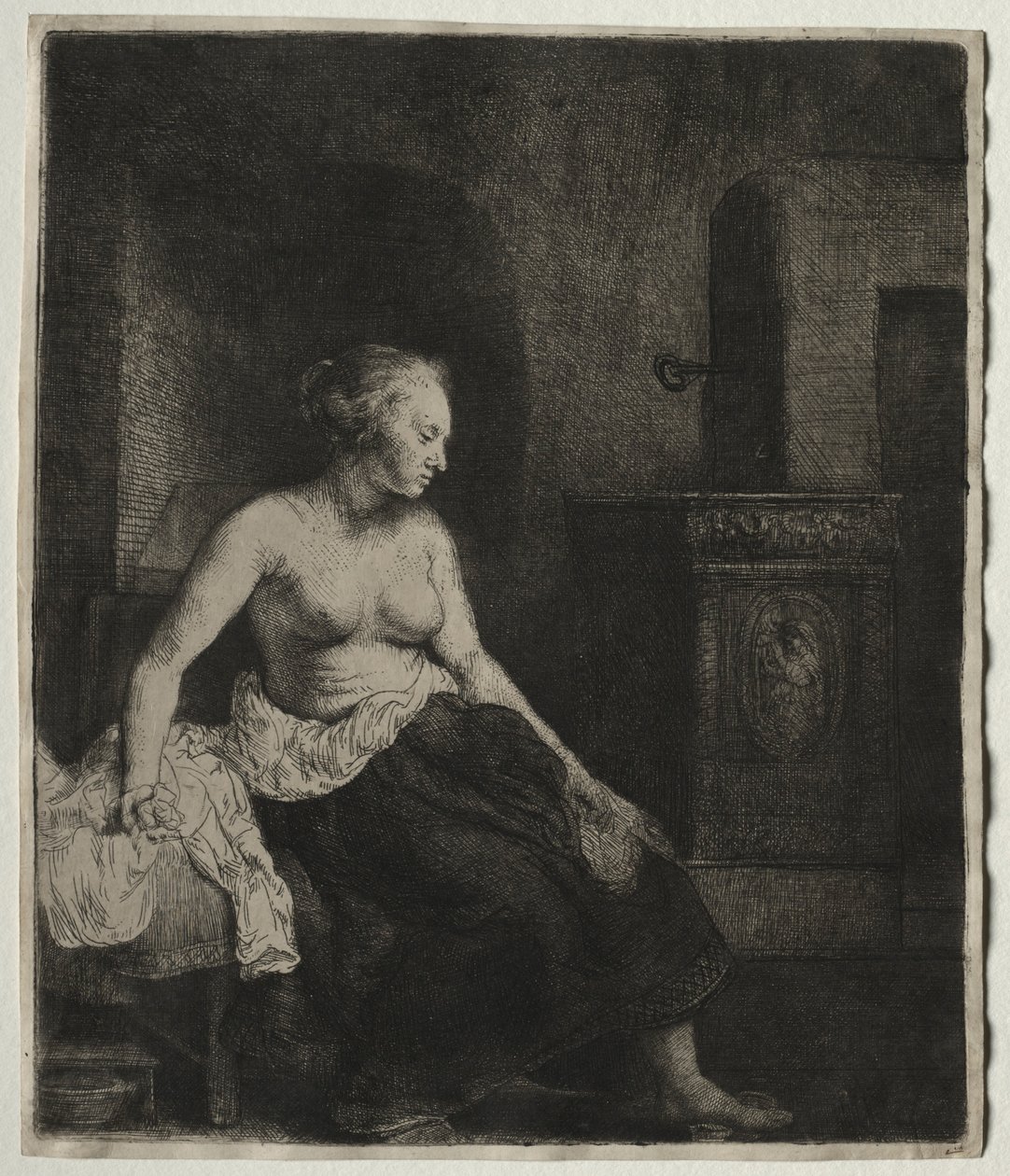 Mujer sentada medio vestida junto a una estufa, 1658 de Rembrandt van Rijn