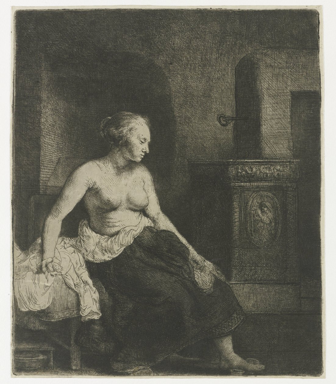 Mujer sentada a medio vestir junto a una estufa de Rembrandt van Rijn