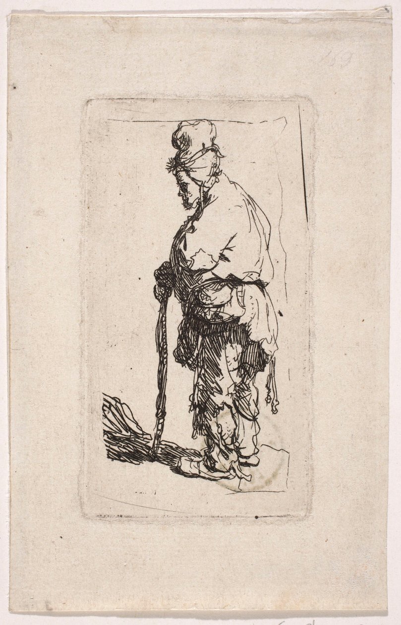 Un mendigo apoyado en un bastón, mirando hacia la izquierda de Rembrandt van Rijn