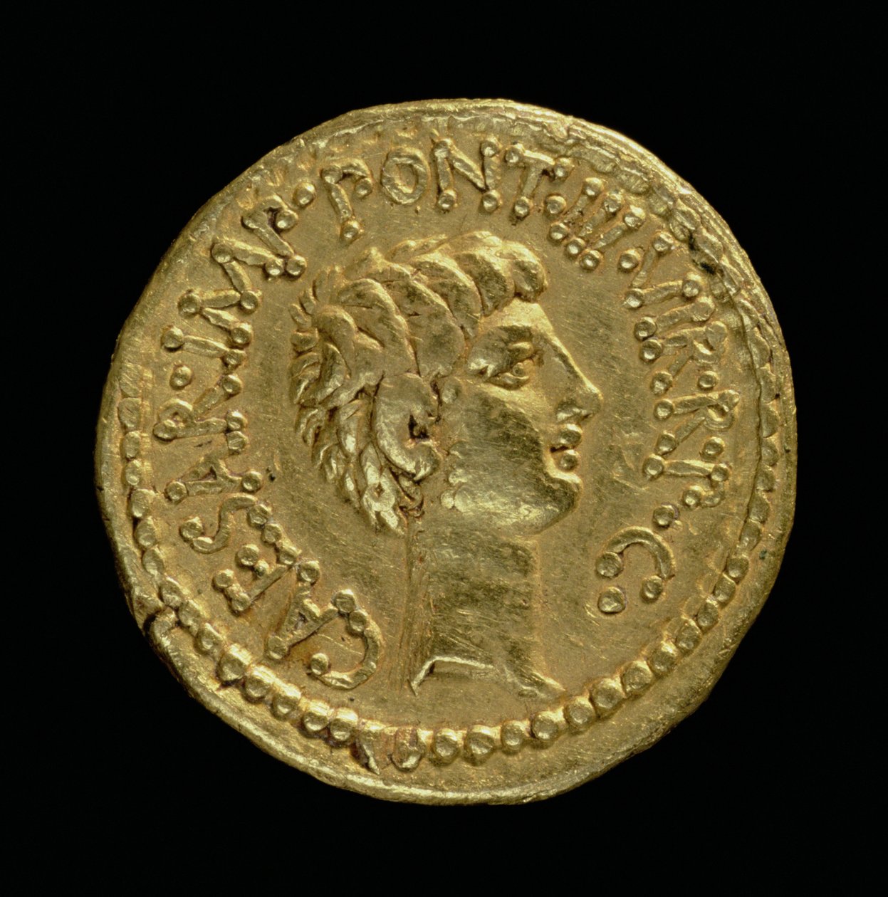 Aureo (reverso) acuñado por Marco Antonio con la cabeza de Octavio (63 AC-14 DC) Inscripción: CAESAR IMP PONT III VIR R P C de Roman