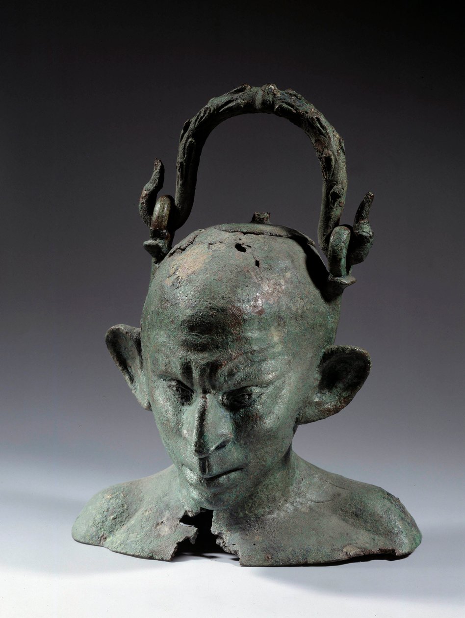 Jarrón en forma de cabeza de bronce: busto de esclavo sirio (?). Siglo II o III d.C. Altura 0,19 m. París, Museo del Louvre de School Syrian