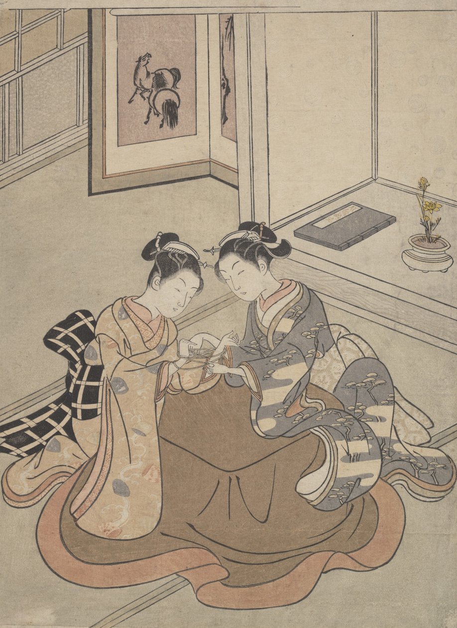Dos mujeres jóvenes sentadas junto a un kotatsu jugando a la cuerda, ca. 1765 de Suzuki Harunobu