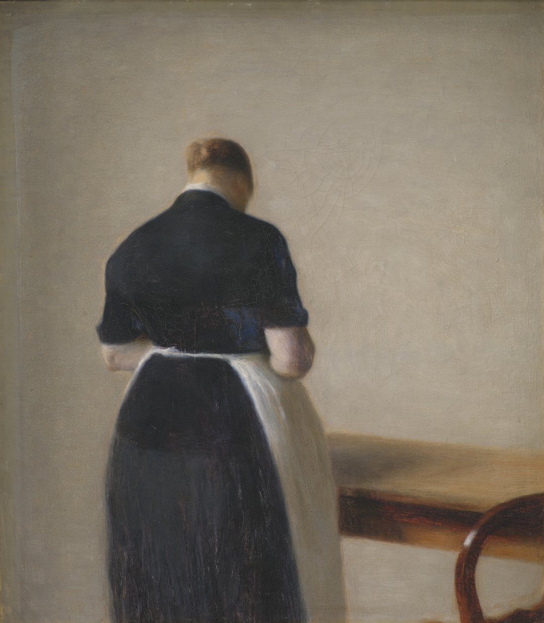 Mujer vista de espaldas de Vilhelm Hammershøi