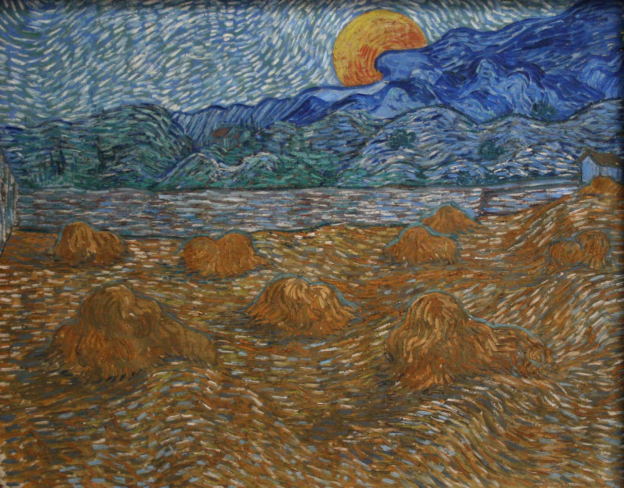 Paisaje con gavillas de trigo y luna creciente de Vincent van Gogh