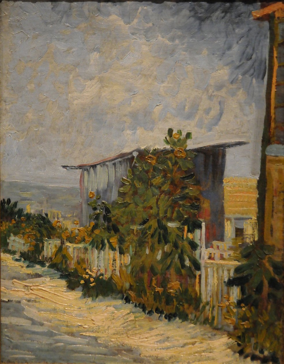 Cobertizo en Montmartre con girasol, 1887 de Vincent van Gogh