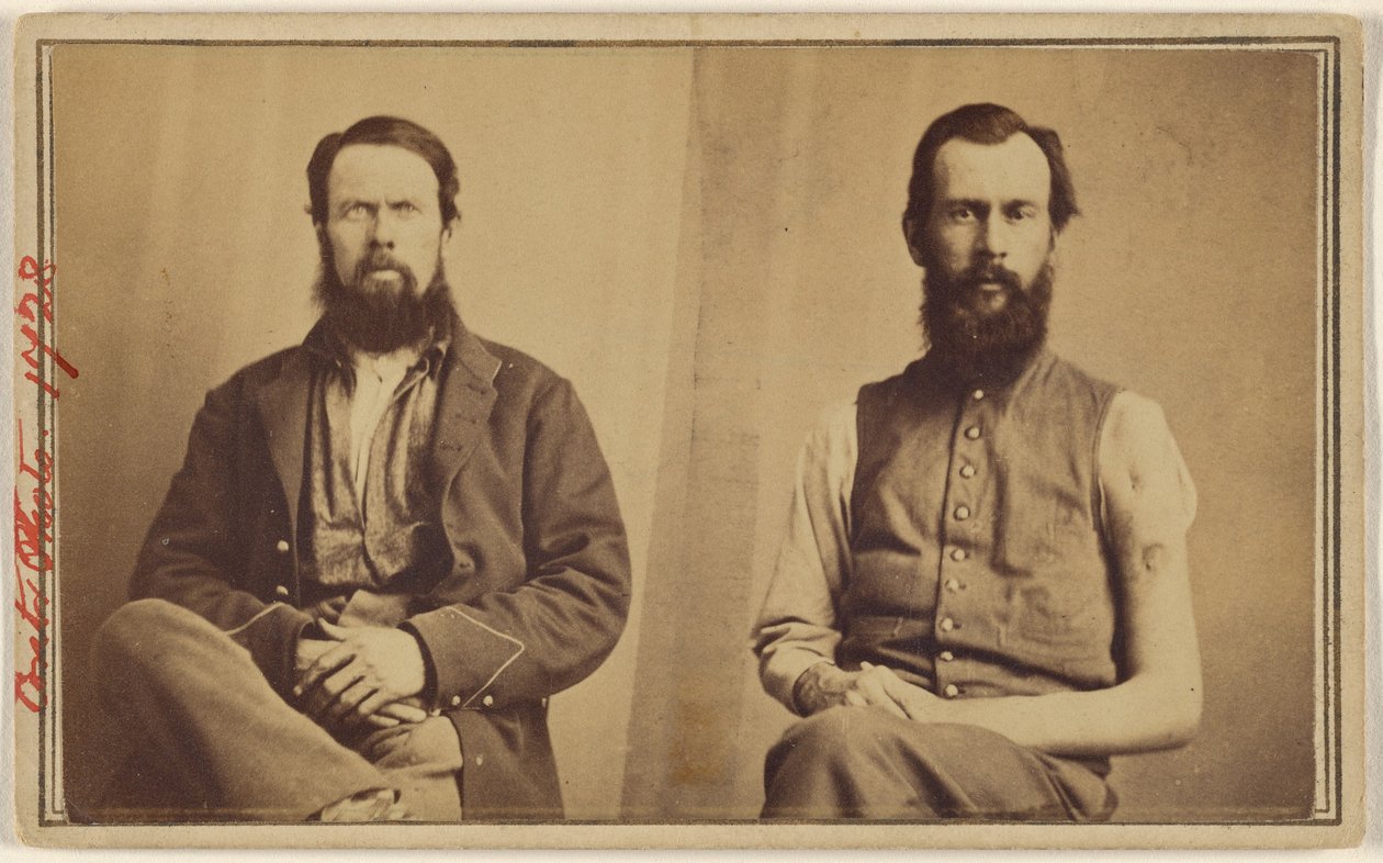 [Dos víctimas de la Guerra Civil no identificadas sentadas] de William H. Bell