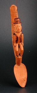 Figura de un hombre europeo sentado en el eje de una cuchara, Sudeste de África, finales del siglo XIX