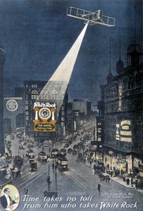 Publicidad de alcohol "White Rock": Un avión iluminando el cartel de "White Rock" colgado en un edificio en Times Square en Nueva York. 1912. de American School