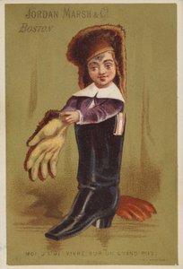 Niño de pie en bota de adulto de American School