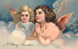 Dos ángeles de Navidad rezando de American School