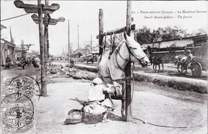Pequeño oficio: el herrero chino. Fotografía de principios del siglo XX. Colección privada