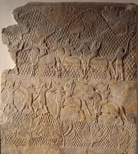 Arte oriental de la antigüedad: escena de batalla. Bajorrelieve del Palacio de Asurbanipal, Asiria (siglo VII a.C.). París, Museo del Louvre de Assyrian