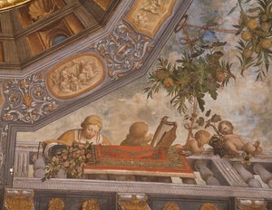 Damas, músico y cupidos en el balcón (detalle) de Benvenuto Tisi da Garofalo