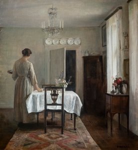La esposa del artista poniendo la mesa