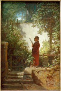 Lector de periódicos en el jardín de la casa