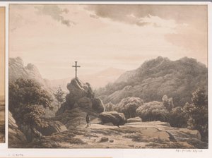 Paisaje de montaña con una cruz en una roca