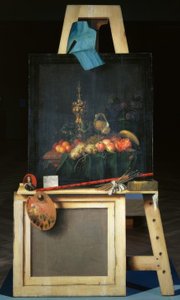 Caballete del pintor con naturaleza muerta de frutas