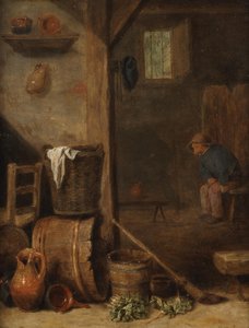 Interior de una cocina con una figura sentada en la habitación contigua