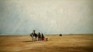 Figuras con un burro en una playa francesa