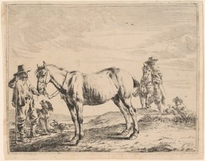 Un hombre sosteniendo un caballo por su brida