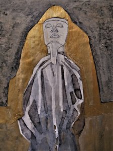 Figura meditativa dorada