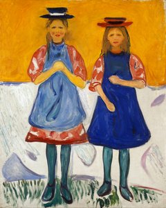 Dos niñas con delantales azules