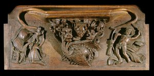 Una misericordia que representa una hidra elaboradamente tallada, simbólica de los siete pecados capitales, incorporando una cabeza humana realista, Capilla del New College, Oxford, finales del siglo XIV (madera)