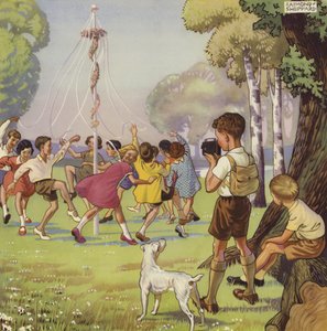 Niño filmando a niños bailando alrededor de un palo de mayo de English School