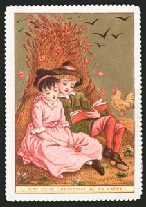 Niño leyendo un libro a una niña en el campo de English School