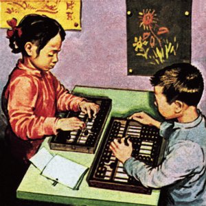 Niños usando ábaco
