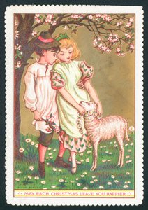 Niña y niño con cordero
