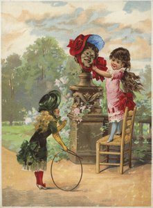 Niña poniendo un gorro en una estatua; otra niña con un aro de English School