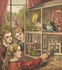 Niñas jugando con una casa de muñecas de English School