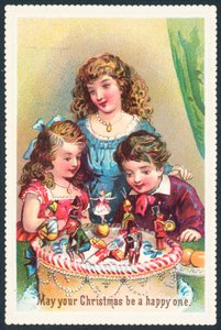Dama y niños admirando pastel de Navidad