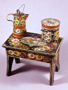 Taburete, cafetera y caja de English School