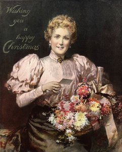 Mujer sosteniendo un ramo de flores, con la leyenda, Deseándote una feliz Navidad