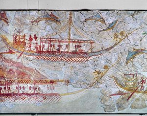 Barcos rodeados de delfines