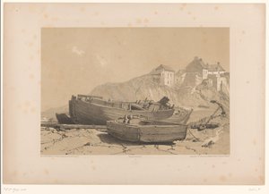Costa rocosa con barcos y pueblo pesquero