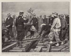 El hombre hábil trabajando en China, reparando un ferrocarril