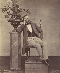 [Mathias Höusermann sentado con el codo sobre un pedestal sosteniendo un jarrón de flores], 1850s-60s de Franz Antoine