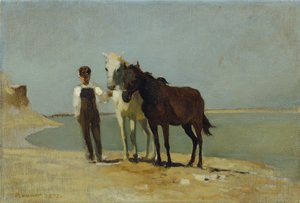 Un niño con caballos en la playa.