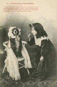 Niña vistiendo a su perro con un gorro de French Photographer