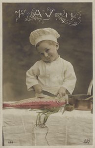 Niño pequeño cocinando un pez de French Photographer